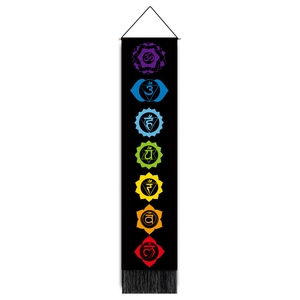 Vertical black chakra tapestry featuring seven colorful symbols with elegant bottom tassels