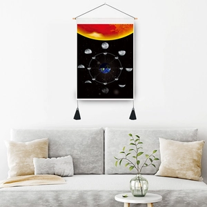 Phases of the moon wall tapestry with celestial planets and black tassels in living room