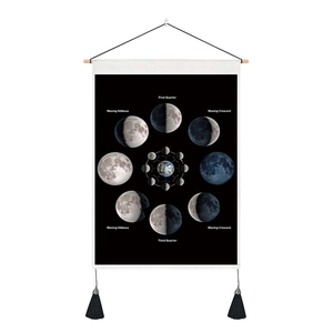 Minimalist moon phase tapestry with black and white moon cycle print and tassels
