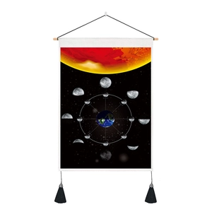 Detail of moon phase cycle tapestry with wooden rod and decorative black tassels