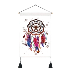 Detailed close-up of a bohemian watercolor feather dreamcatcher tapestry with black tassels