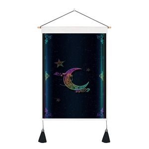 Detail of artistic moon mandala tapestry featuring wooden rod and black bottom tassels