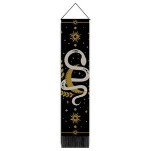 Macro view of totem snake wall tapestry with celestial moon phases and gold tassels