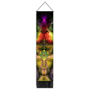 Detailed view of the psychedelic art tapestry featuring colorful facial patterns and tassels