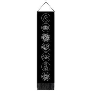 Detailed view of the 7 chakra yoga wall tapestry with black fringes and hanging cord