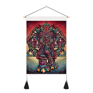 Close-up of psychedelic elephant tapestry featuring detailed fabric texture and black tassels