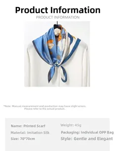 Detailed view of floral silk scarf tied on a white shirt collar for styling