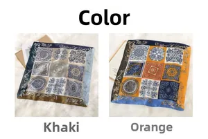 Detail view of khaki and orange retro Baroque pattern silk scarves on white faux fur