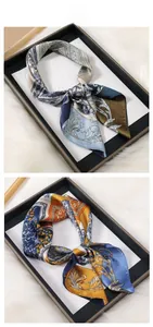 Close-up of vintage baroque pattern printed silk scarves with glossy finish and vibrant colors