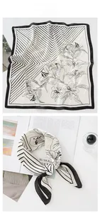 Dettaglio foulard in seta con righe geometriche e stampa floreale di gigli su bianco