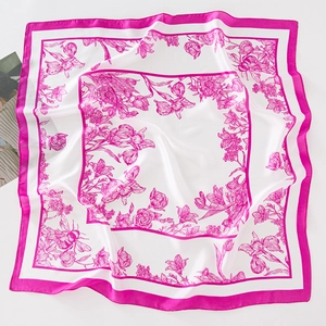 Detailed view of square silk scarf featuring floral rose prints and honeybee patterns