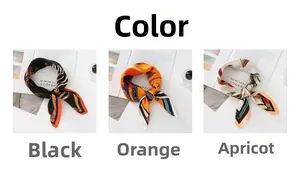 Detailed view of French vintage chain print silk scarves in black, orange, and apricot