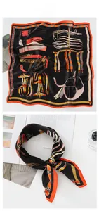 Detailed close-up of silk-satin scarf with vintage horse bridle print and orange border