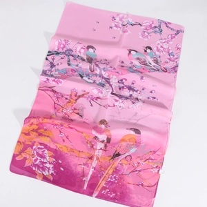 Detail view of 100% silk pink scarf with traditional Chinese magpie and floral print