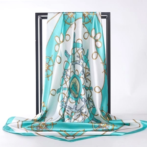 Silk square scarf with nautical compass print and anchor pattern on teal background