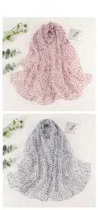 Detail display of leopard print chiffon scarves in pink and grey animal patterns