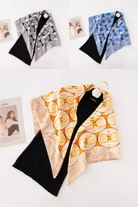 Detailed pattern comparison of printed silk scarves in gray, blue and orange colorways