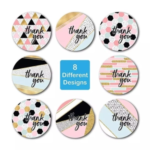 Detailed view of 8 different styles of 1-inch thank you sticker labels for gift packaging