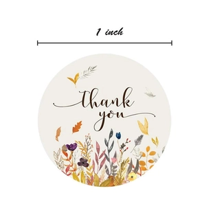 Roll of 1 inch round floral thank you stickers with colorful watercolor botanical patterns