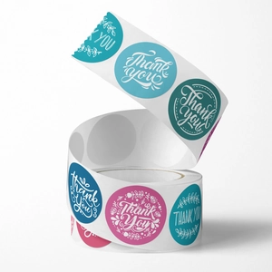 Roll of floral thank you stickers in peacock blue and rose pink for wedding gift seals