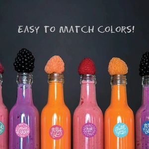 Colorful Thank You labels on glass bottles with fresh fruits and stylish typography