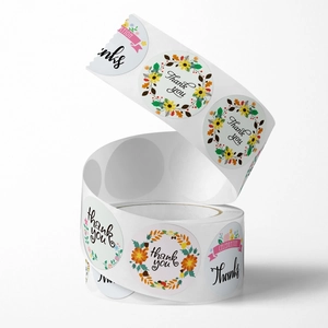 Roll of floral Thank You stickers featuring various designs for wedding and party favor decor