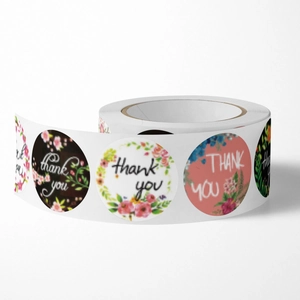 Roll of round floral Thank You stickers for wedding gift packaging and party favor sealing