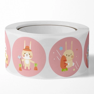 Roll of cute cartoon rabbit stickers with pink background for holiday gift packaging