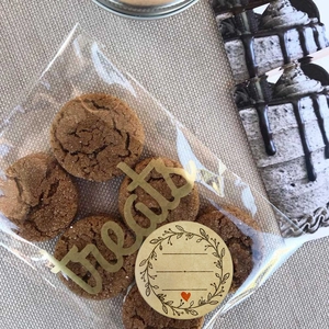 Brown kraft paper seal stickers on transparent cookie bags for gift packaging decoration