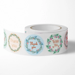 Floral roll of circular Thank You stickers in assorted pastel colors for gift packaging