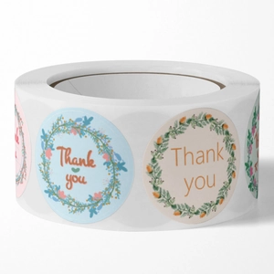 Floral Thank You stickers on a roll with elegant wreath designs for gift packaging