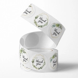 Rolle mit Thank You Aufklebern, Blumenmuster und goldener geometrischer Rahmen