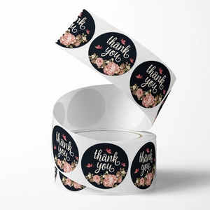 Floral Thank You stickers roll featuring pink roses and butterflies on a black background