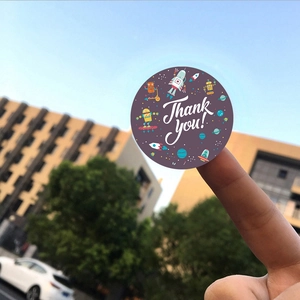 Space-themed round Thank You stickers with cartoon robot and spaceship for gift sealing