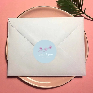 Floral Thank You stickers on light blue background for envelopes and small business packaging
