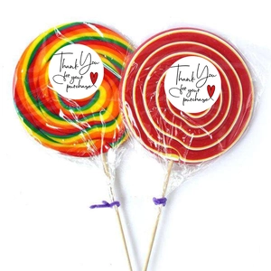 Rainbow swirl lollipops with Thank You For Your Purchase stickers in white gift packaging