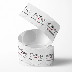 Spiral roll of white Thank You For Your Order round stickers with red heart detail