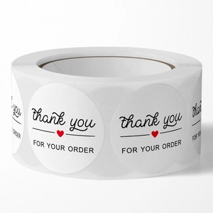 White round 'Thank You For Your Order' stickers on a roll with a small red heart