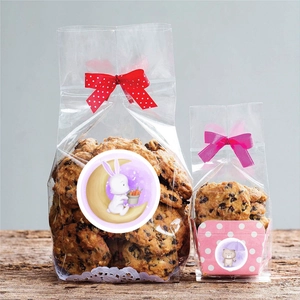 Cartoon animal stickers on transparent baking bags with cute bear and rabbit motifs