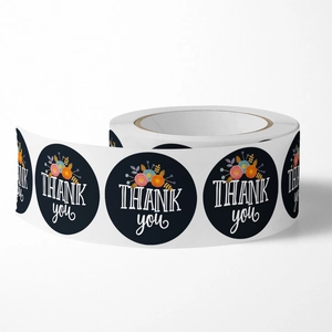Floral Thank You stickers on black roll for wedding favors and gift packaging decoration