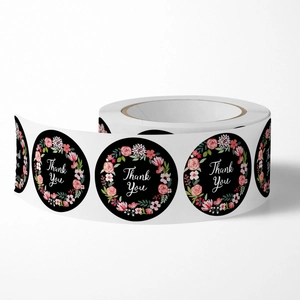 Floral round Thank You adhesive roll stickers with pink flower design on black background