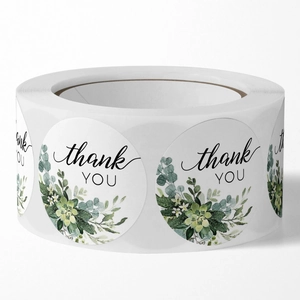 Roll of round Thank You stickers with green succulent illustrations and elegant script