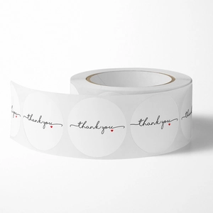 White circular thank you stickers with red heart for gift sealing and packaging