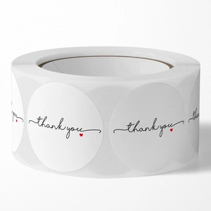 White round 'thank you' stickers roll with small red heart for gift sealing