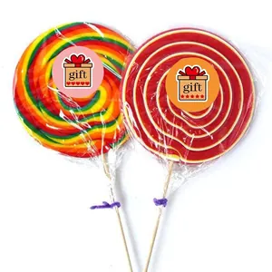 Rainbow and red-white spiral lollipops on wooden sticks for gift decoration