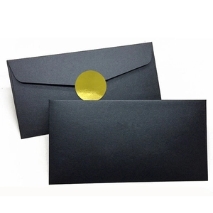 Blank black envelopes with a round gold metallic sticker seal set on white background