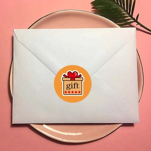 Cute orange gift seal sticker with cartoon gift box and five stars on white envelope