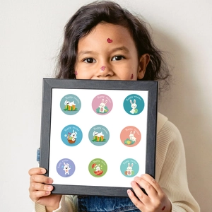 Child holding framed Happy Easter stickers with cute bunny and egg designs in 9 patterns
