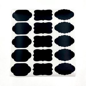 Macro shot of 15 black matte waterproof chalkboard labels in three distinct wavy shapes