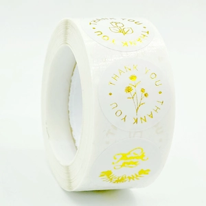 Roll of white gold foil thank you stickers with rose floral design for gift packaging